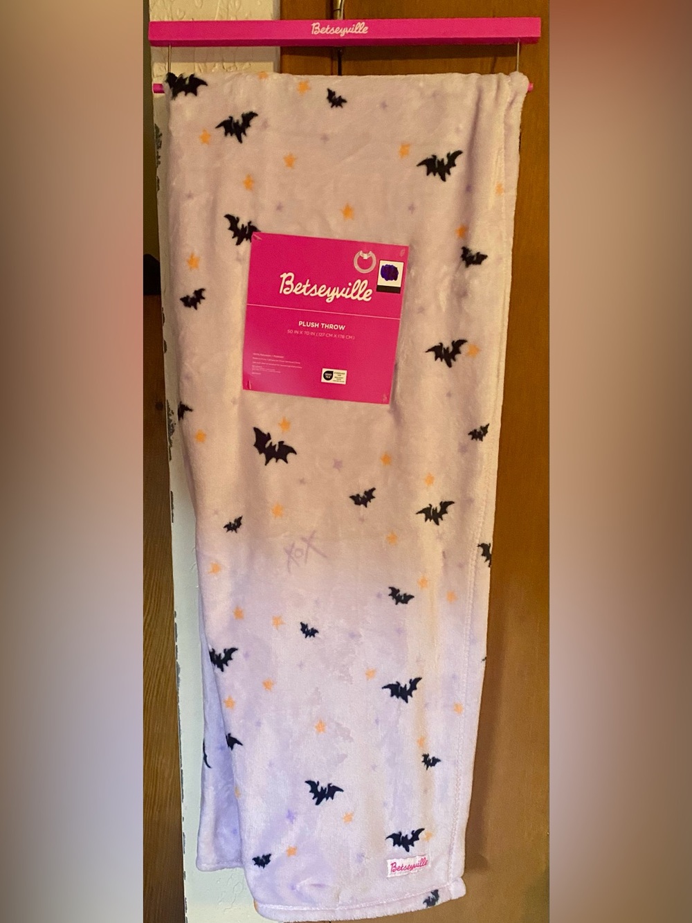 Betseyville plush blanket pattern of black bats yellow stars lavender background
